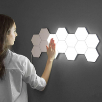 Lámparas de pared con iluminación hexagonal táctil